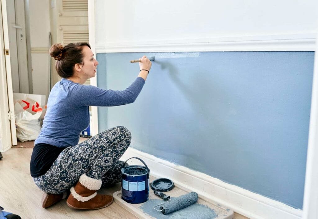 woman painting wall at home .jpg
